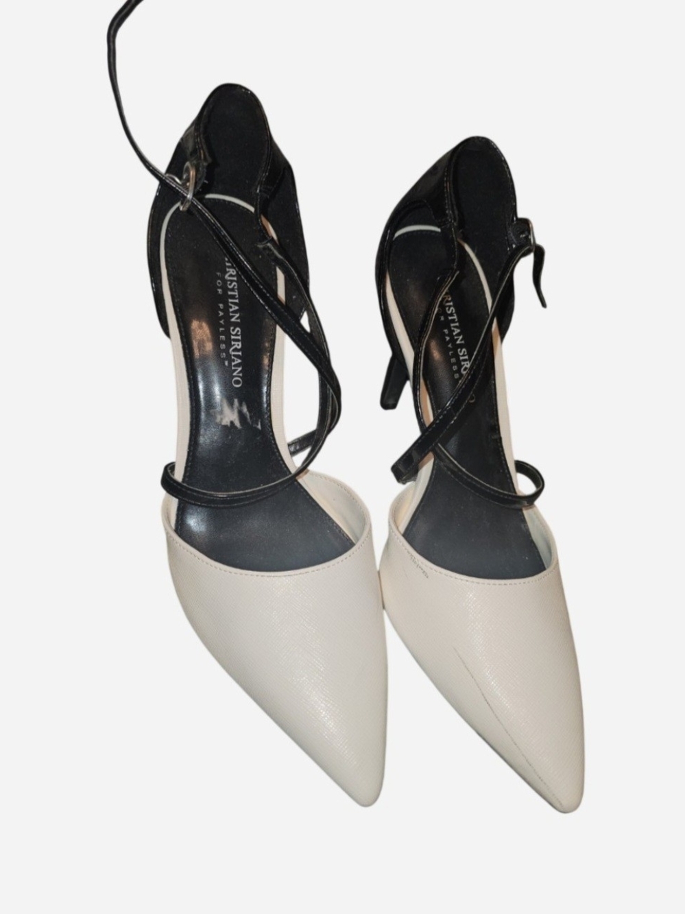 Chic pointed-toe pumps featuring a black and cream colorblock design Size 10